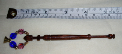 bobbin with cross carved into shank